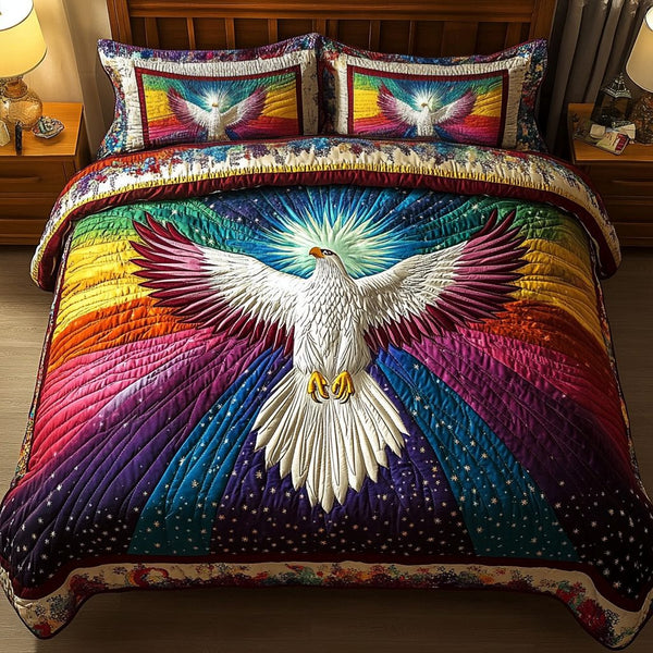 Winged Majesty quilted 3-piece bedding set on a made bed with two matching pillow shams