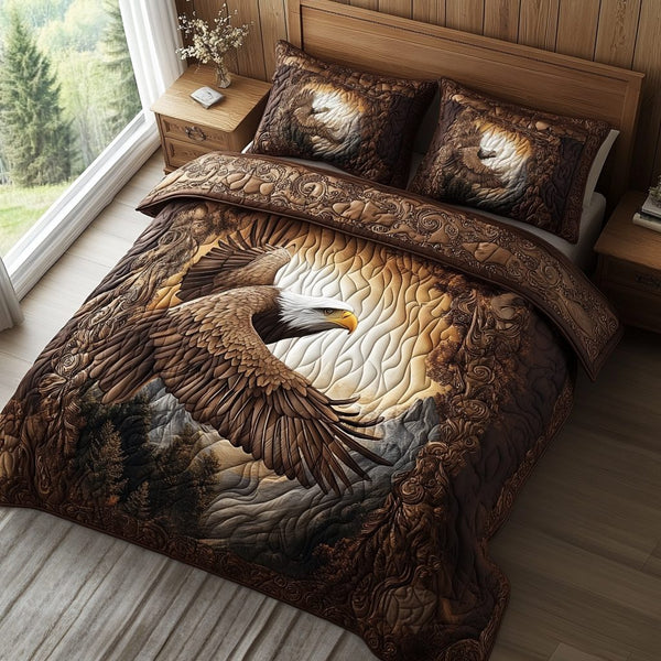 Winged Pride quilted 3-piece bedding set on a made bed with two matching pillow shams