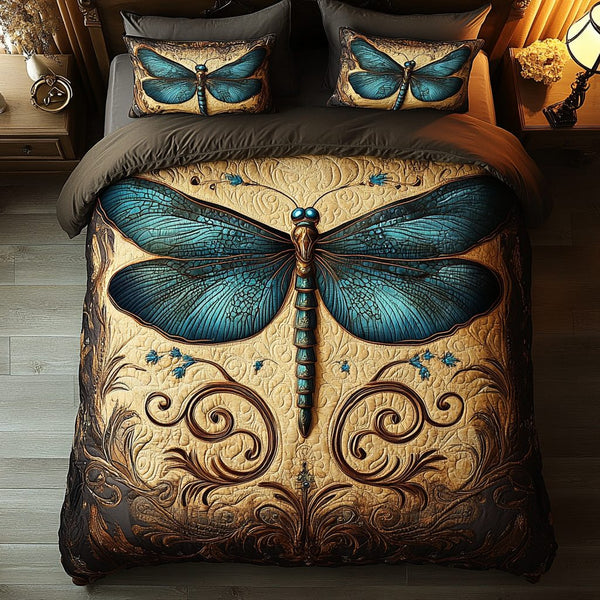 Winged Whisper quilted 3-piece bedding set on a made bed with two matching pillow shams