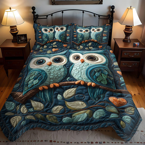 Wings of Affection quilted 3-piece bedding set on a made bed with two matching pillow shams