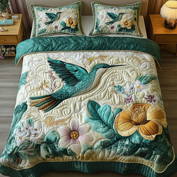 Wings of Beauty quilted 3-piece bedding set on a made bed with two matching pillow shams