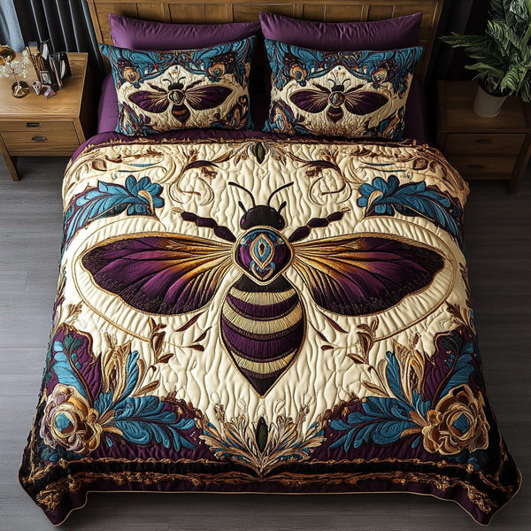 Wings of Gold quilted 3-piece bedding set on a made bed with two matching pillow shams