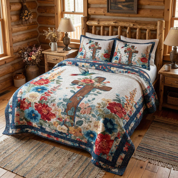 Wings of Grace Garden quilted 3-piece bedding set on a made bed with two matching pillow shams