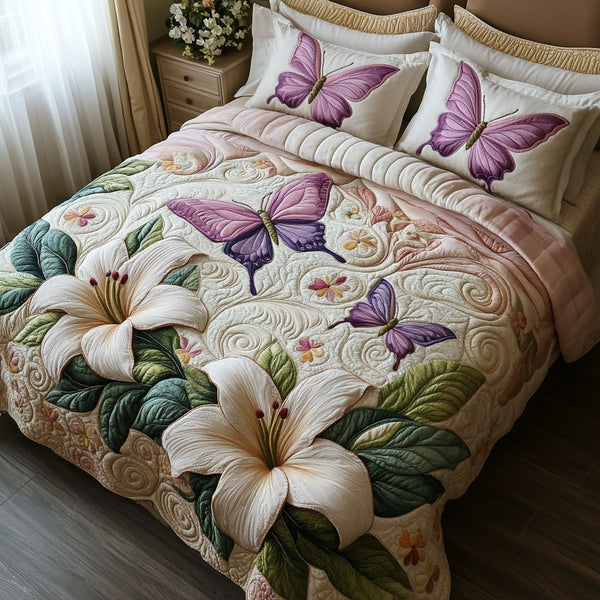 Wings of Grace quilted 3-piece bedding set on a made bed with two matching pillow shams