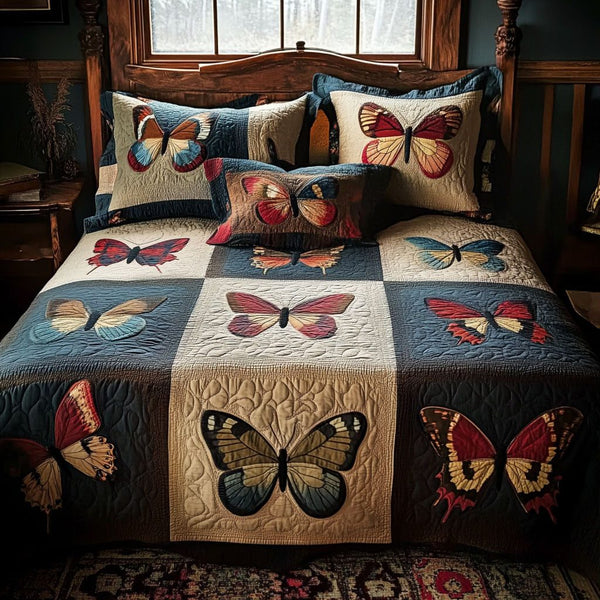 Wings of Grace quilted 3-piece bedding set on a made bed with two matching pillow shams