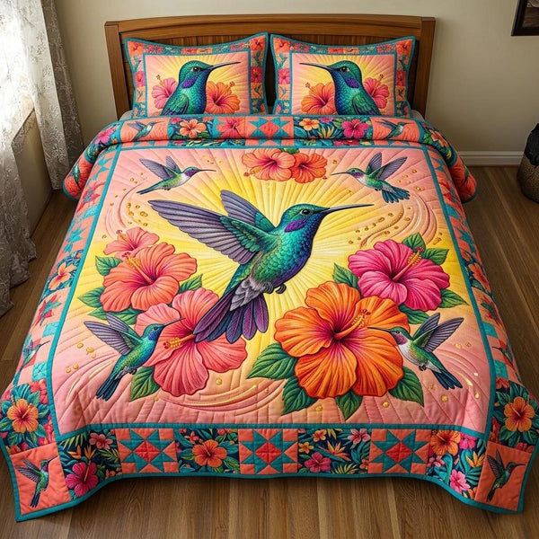 Wings of Joy quilted 3-piece bedding set on a made bed with two matching pillow shams