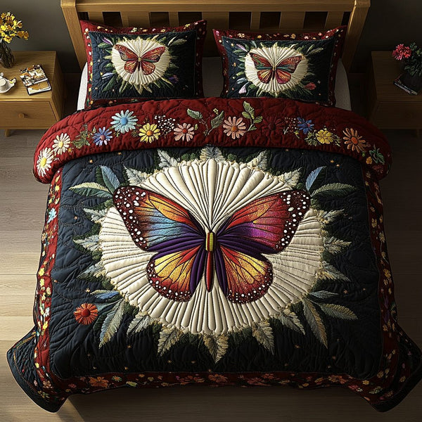 Wings of Joy quilted 3-piece bedding set on a made bed with two matching pillow shams