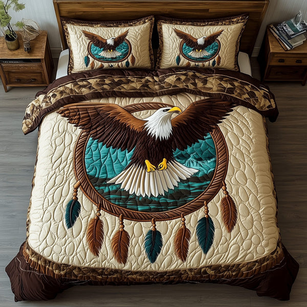 Wings of Native Spirit quilted 3-piece bedding set on a made bed with two matching pillow shams
