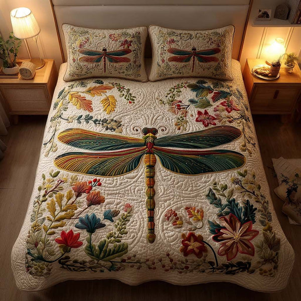 Wings of Tranquility quilted 3-piece bedding set on a made bed with two matching pillow shams