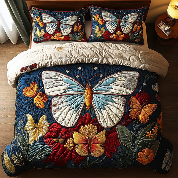 Wings of Wonder quilted 3-piece bedding set on a made bed with two matching pillow shams