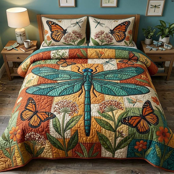 Wingsofthe Garden quilted 3-piece bedding set on a made bed with two matching pillow shams
