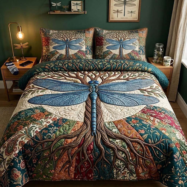 Wingsofthe Garden quilted 3-piece bedding set on a made bed with two matching pillow shams