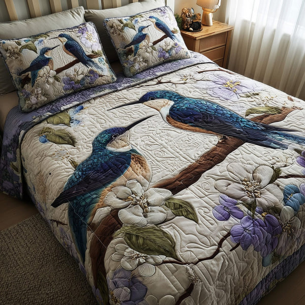 Winter Hummingbird Love quilted 3-piece bedding set on a made bed in a winter-styled bedroom