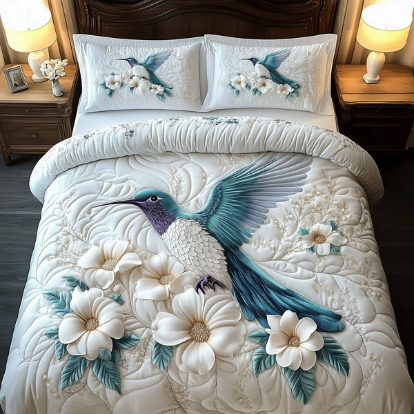 Winter Hummingbird quilted 3-piece bedding set on a made bed in a winter-styled bedroom