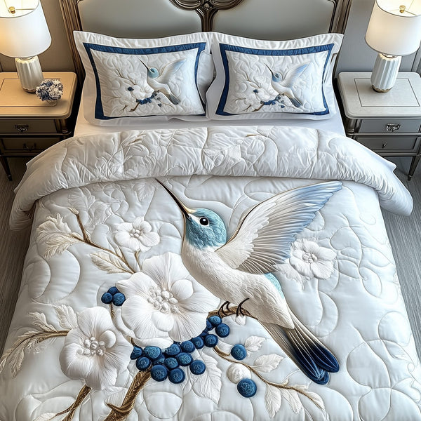 Winter Hummingbird quilted 3-piece bedding set on a made bed in a winter-styled bedroom
