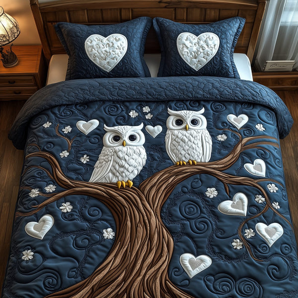 Winter Owl Couple quilted 3-piece bedding set on a made bed in a winter-styled bedroom