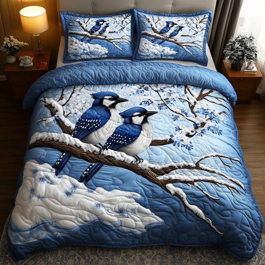 Winter Pair Jays quilted 3-piece bedding set on a made bed in a winter-styled bedroom