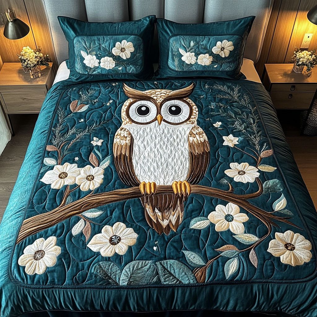 Wisdom Keeper quilted 3-piece bedding set on a made bed with two matching pillow shams