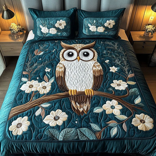 Wisdom Keeper quilted 3-piece bedding set on a made bed with two matching pillow shams