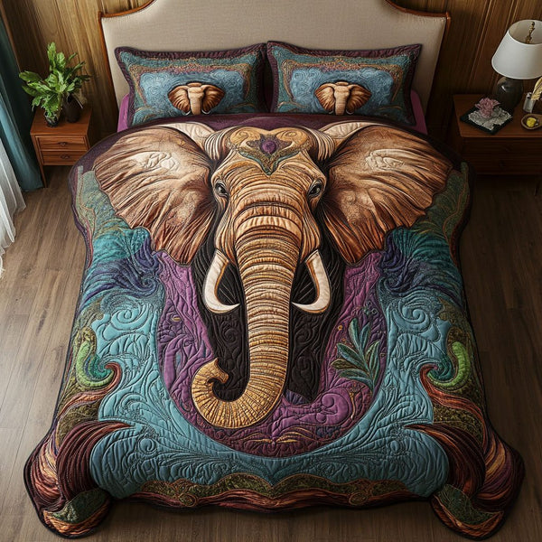 Wisdom of the Elephant quilted 3-piece bedding set on a made bed with two matching pillow shams