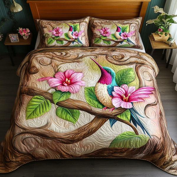 Woodland Hummingbird quilted 3-piece bedding set on a made bed with two matching pillow shams