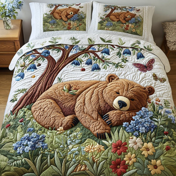 Woodland Rest quilted 3-piece bedding set on a made bed with two matching pillow shams