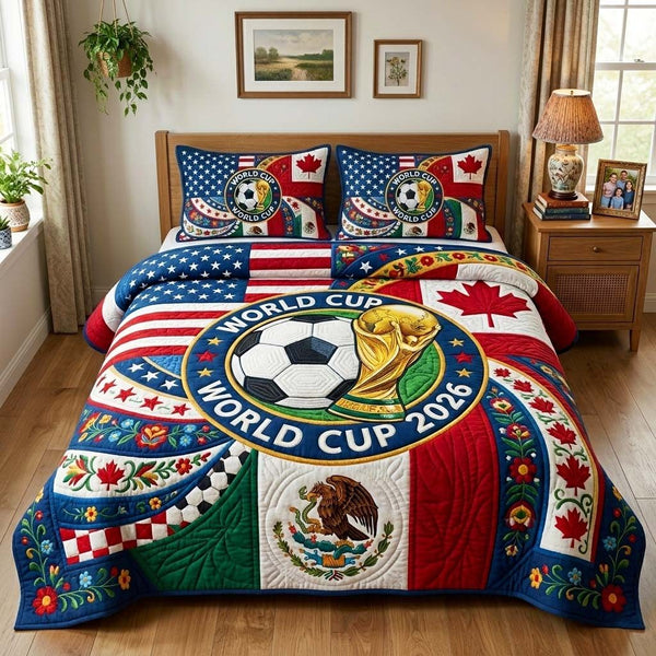World Cup quilted 3-piece bedding set on a made bed with two matching pillow shams