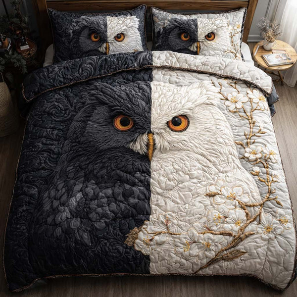Yin Yang Owl quilted 3-piece bedding set on a made bed with two matching pillow shams