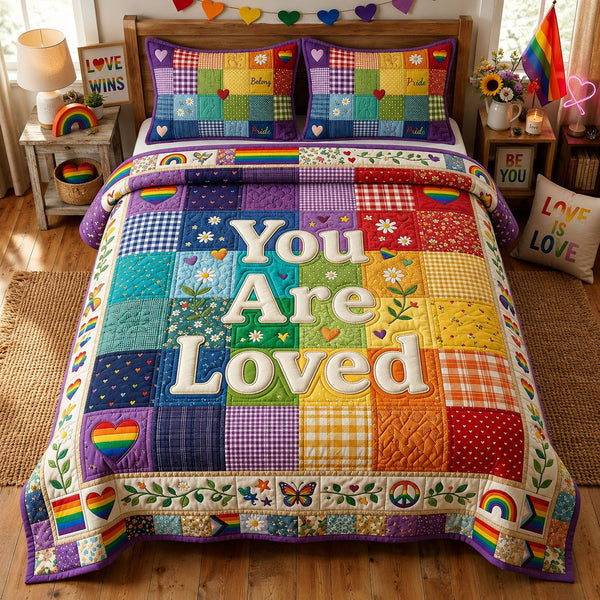 You Are Loved quilted 3-piece bedding set on a made bed with two matching pillow shams