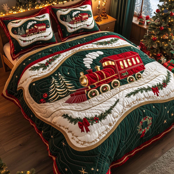 Yuletide Express quilted 3-piece bedding set on a made bed with two matching pillow shams